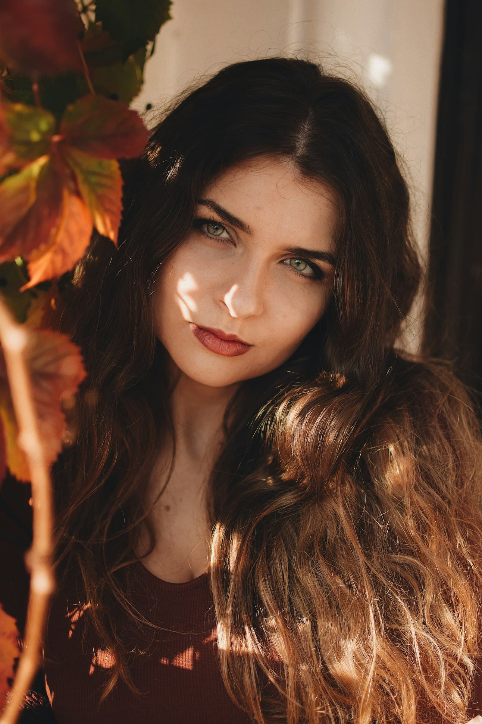 A beauty professional at work in warm light
